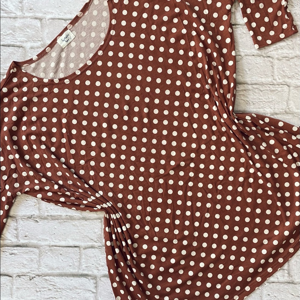 Faded red and white polka dotted tunic